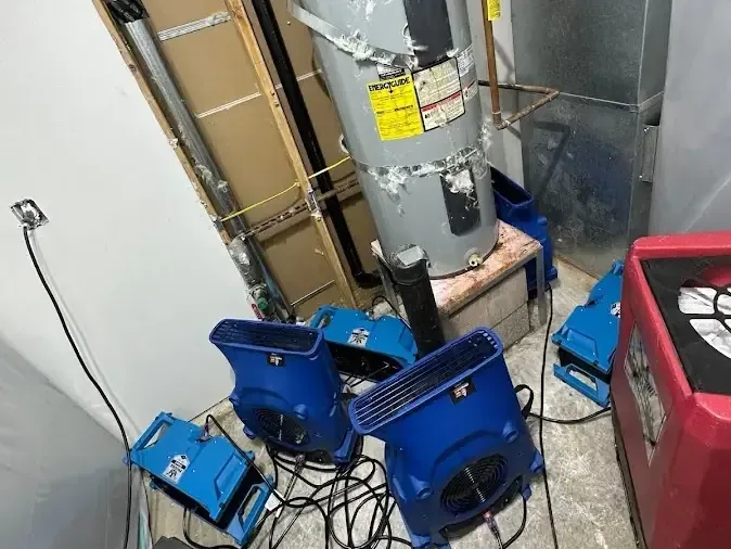 Drying equipment running inside a closet that holds a water heater